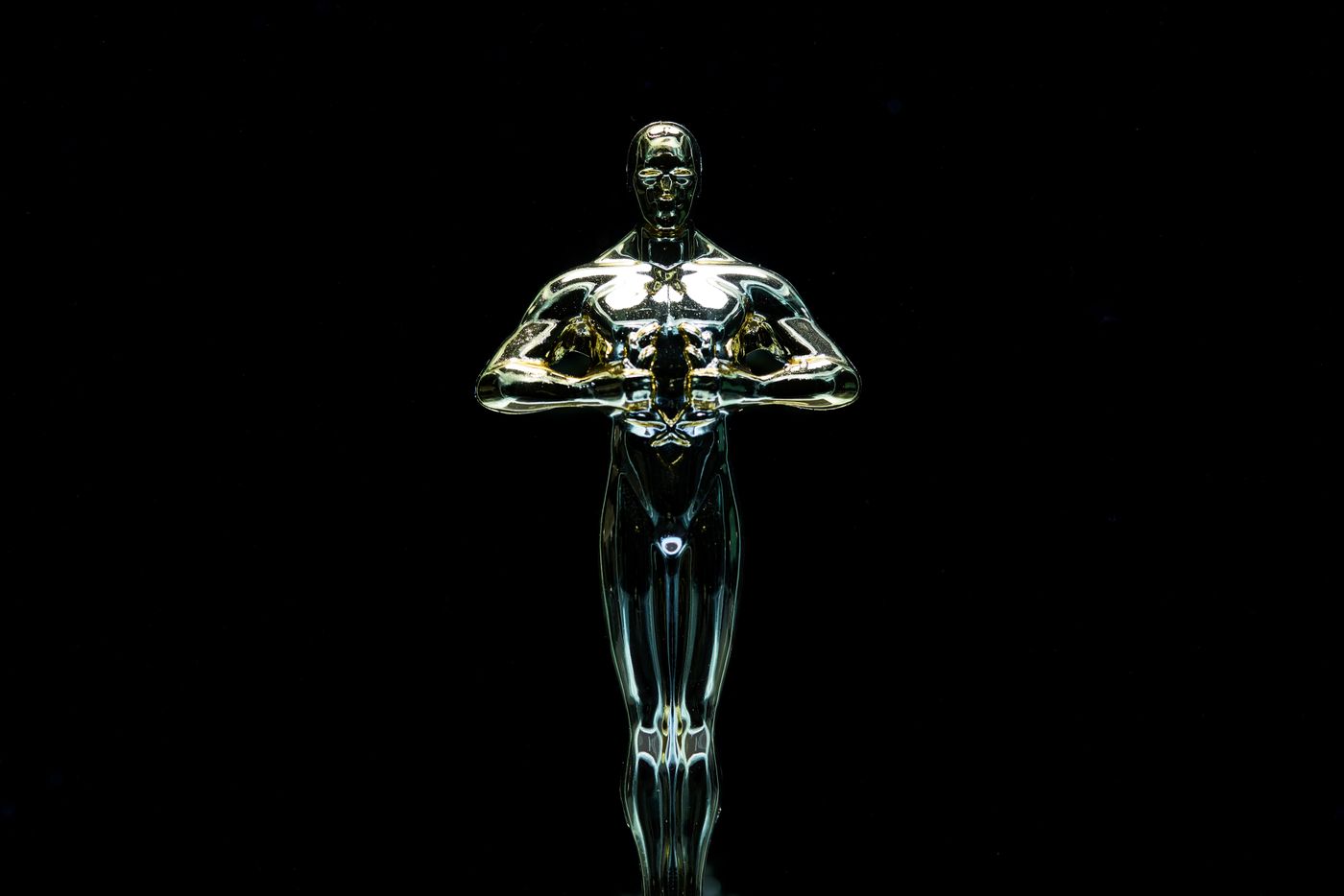 Golden award statue on black